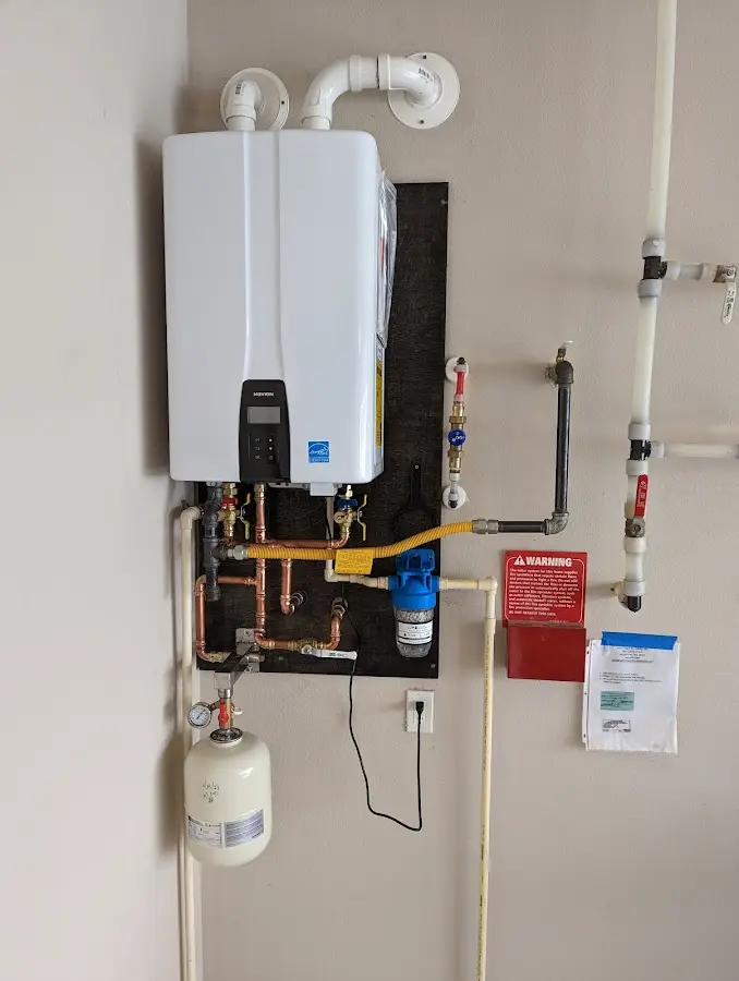 Professional plumber installing copper piping in a Lahaina home